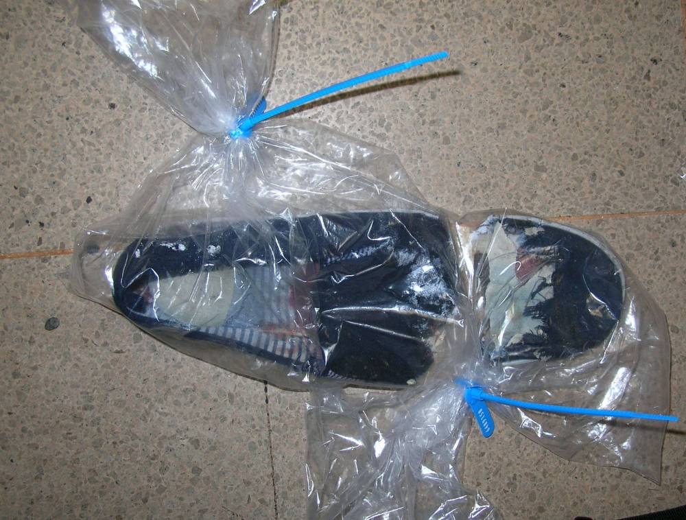 Michael Reddington's shoe after he lost his toe in the West End Arcade Escalator. See News Team story NTITOE; Bosses of Nottingham's West End Arcade have been fined £75,000 after a shopper's big toe was sliced off on the escalator. Hodgson Elkington, the managing agent of the arcade, between Long Row and Upper Parliament Street, was orders to pay costs of £50,000. A guilty plea was entered to a health and safety offence last week by the barrister acting on behalf of the company. Michael Reddington, 25, of St Ann's, screamed in agony when he reached the top of the escalator and realised his left foot was trapped under a missing front part of a step, effectively acting as a guillotine on his toe.