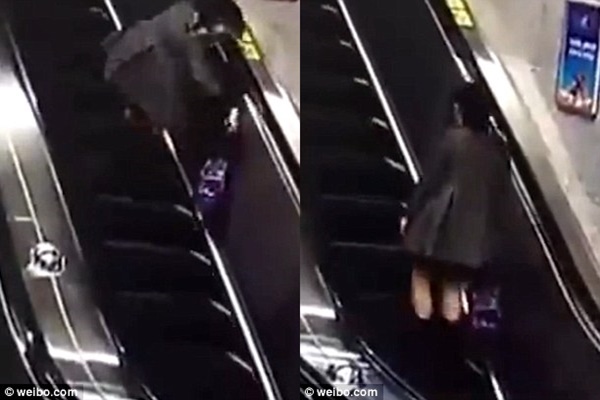 Wanita Pakai High Heels Naik Eskalator Jatuh Tergolek