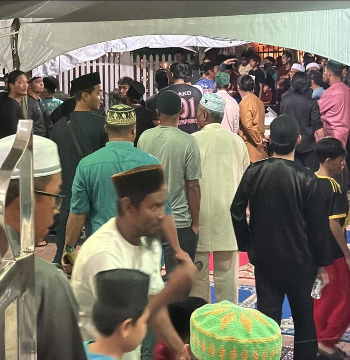 Crowd gathering in a festive setting.